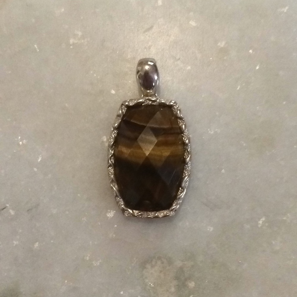 Silver and tiger eye pendant.